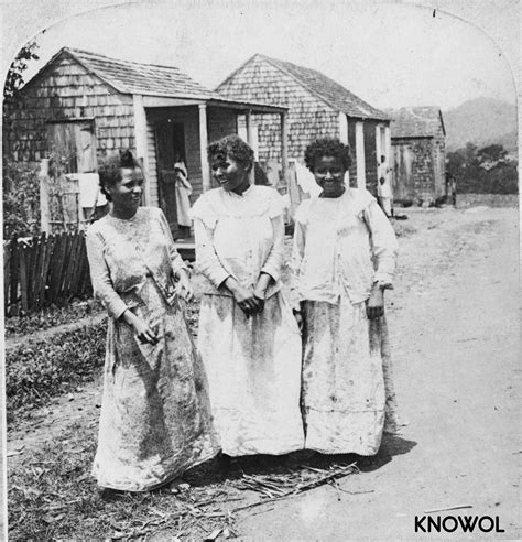 Three native Puerto Rican women in front of their hut houses - KNOWOL