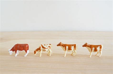 SUMMER SALE Four Vintage Plastic Cow Toy Figurines Brown White