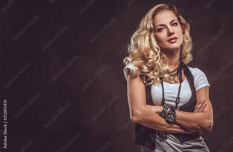 Sensual Curly Blonde Female Dressed In A White T Shirt And Waistcoat Wears A Lot Of Accessories