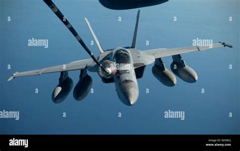 A Royal Australian Air Force Fa 18 Super Hornet Is Refueled By A Us