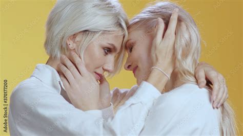 Happy Blonde Woman With Girlfriend Rubbing Her Nice Blonde Hair Embrace Gently Touch Each Other
