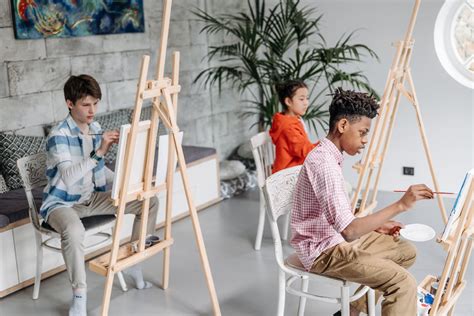 Students Painting on Canvas during an Art Class · Free Stock Photo