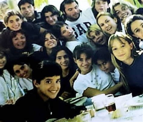 A Large Group Of People Sitting At A Table