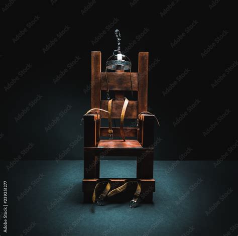 Electric chair in a dark background Stock Photo | Adobe Stock