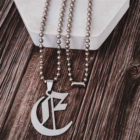 silver    alphabet letter stainless steel pendent  rs piece