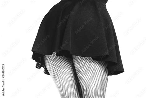 Seductive Woman In Black Fishnets And Black Mini Skirt Sexy Legs