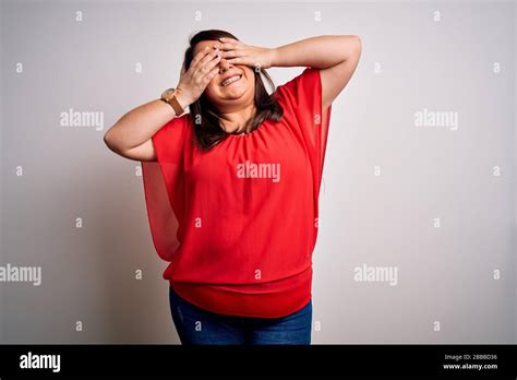 Beautiful Brunette Plus Size Woman Wearing Casual Red T Shirt Over Isolated White Background