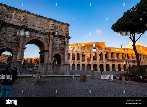 Arco Di Constantino And Colosseum Against A Clear Blue Sky During