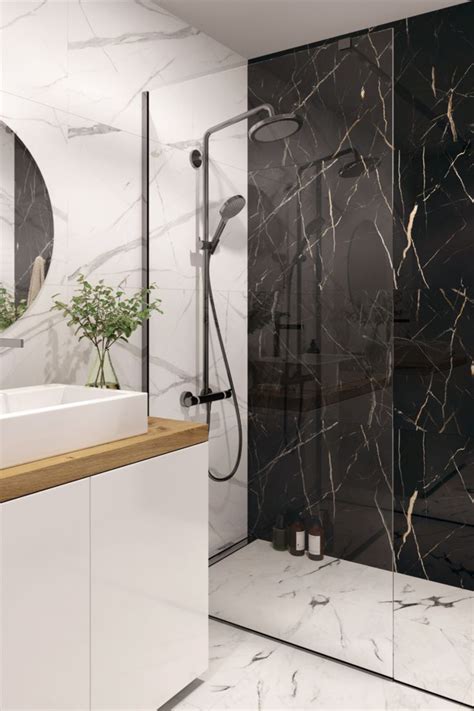 A Bathroom With A Walk In Shower The Walls Are Clad In White Marble