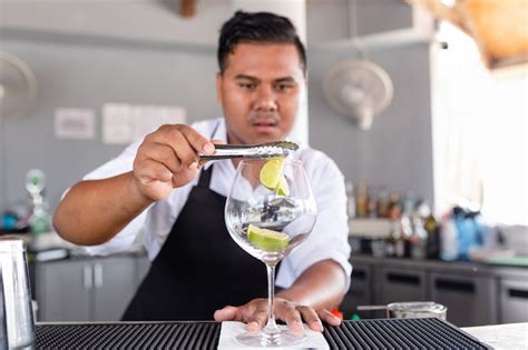 Premium Photo Bartender Is Making Cocktail At Counter Bar