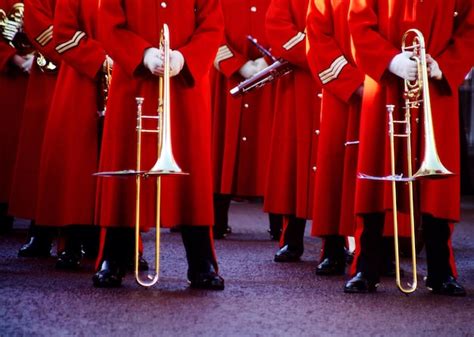 Premium Photo | Low section of army soldiers wearing red uniform during ...