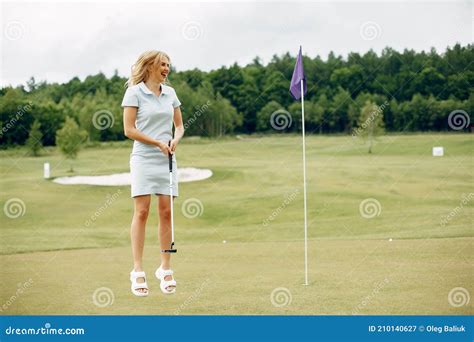 Beautiful Girl Playing Golf On A Golf Course Stock Image Image Of