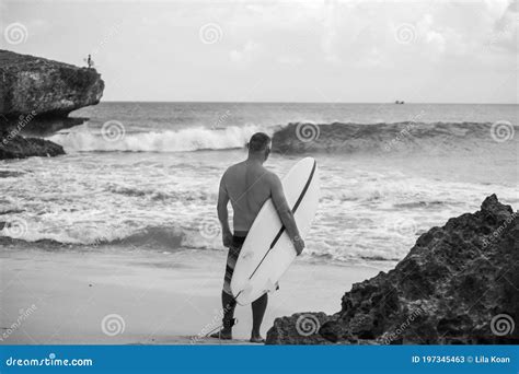 Black And White Portrait Of Handsome Shirtless Man Surfer Holding