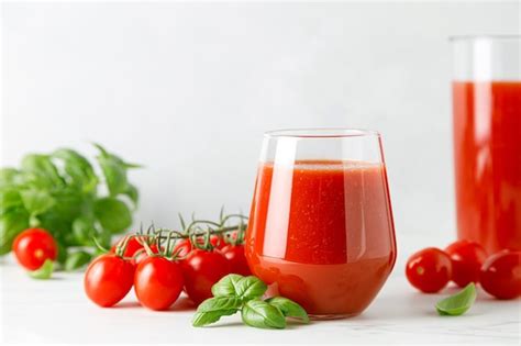 Premium Photo Tomato Juice In A Glass And Fresh Tomatoes