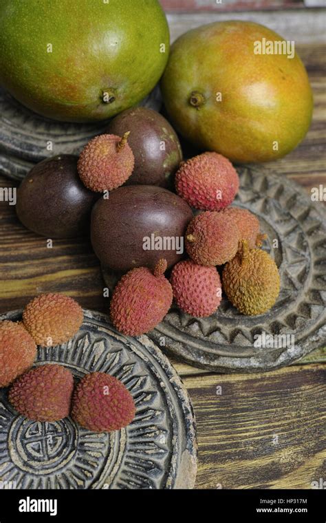 Tropical Fruits Lychees And Passion Fruit Or Maracuya And Mango On Wooden Background Stock