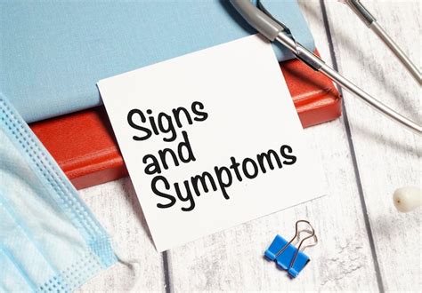 Premium Photo | Signs and symptoms words on white sticker and stethoscope