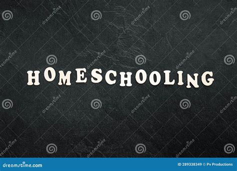 Homeschooling Word Made Of Wooden Letters On A Black Background Top