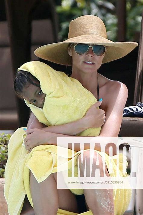 EXCLUSIVE Heidi Klum Shows Off Her Toned Bikini Body While Lounging By