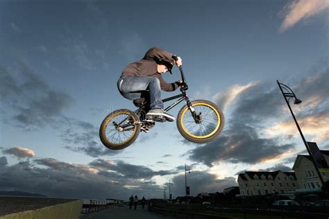 BMX stunts at the street stock photo. Image of movement - 33758364