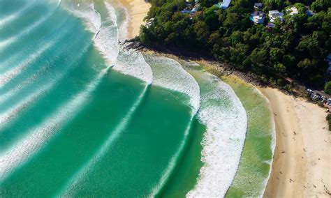 Noosa, Australia. World-class point breaks with a stunning National Park.