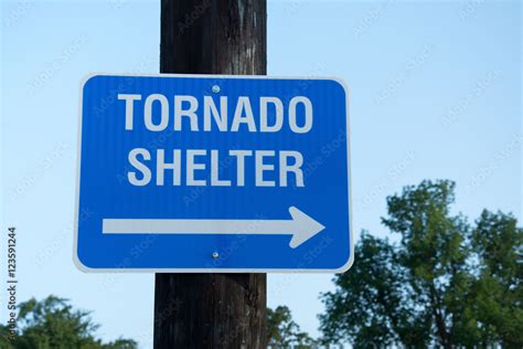 Tornado shelter sign to guide people to safety in tornado emergency ...