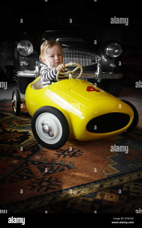 Baby boy driving toy car Stock Photo - Alamy