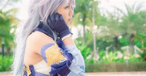 A Female Cosplayer Wearing a Purple Costume · Free Stock Photo