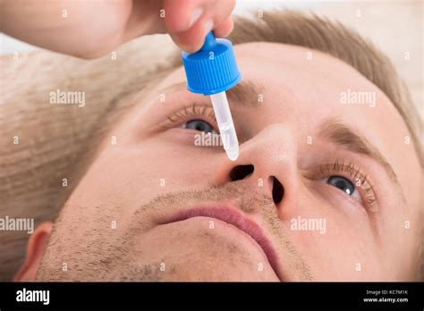 Close Up Photo Of Man Using Nasal Spray Stock Photo Alamy