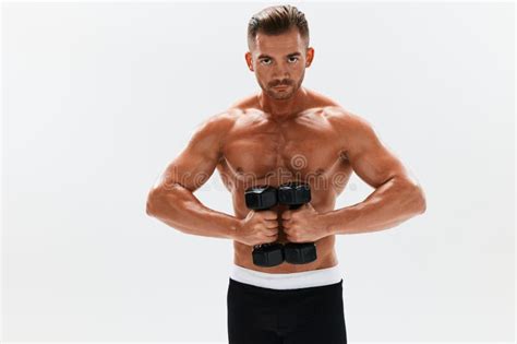 Man Athletic Body Bodybuilder Posing With Dumbbells With Naked Torso Abs Full Length In The