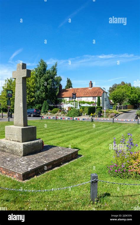 War Memorial And The Red Lion Pub On The Green High Street Chalgrove