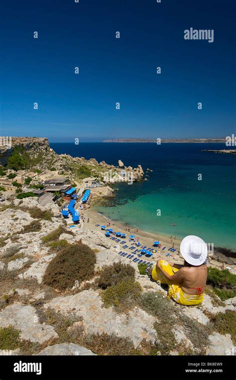 Woman Looking On Paradise Bay In Cirkewwa Malta Europe Stock Photo