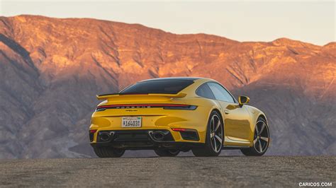 Porsche 911 Turbo | 2021MY (Color: Racing Yellow; US-Spec) | Rear Three-Quarter