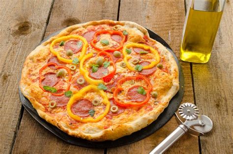 Italian Pizza With Paprika Salami And Olives Stock Photo Image Of