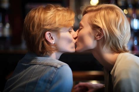 Premium AI Image Closeup Shot Of An Unrecognisable Lesbian Couple Kissing Each Other At A Bar