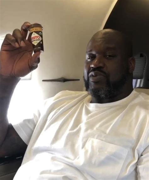 Shaq Holding Things