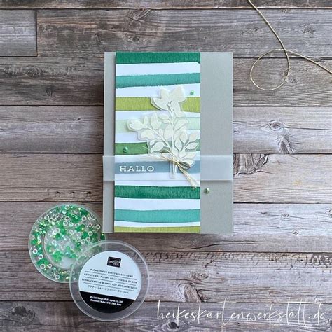 A Card And Some Crafting Supplies On A Wooden Table