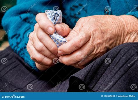 An Old Grandmother Holds A Handkerchief In Her Hands The Hands Of An