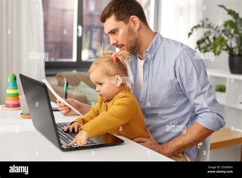 working father with baby daughter at home office Stock Photo - Alamy