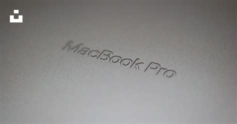 A close up of a macbook pro logo photo – Free Text Image on Unsplash