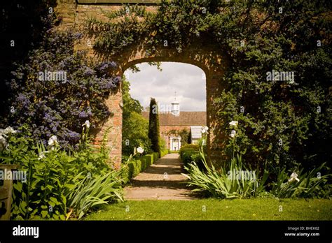 Brick Archway Leading Into Walled Garden Stock Photo Alamy