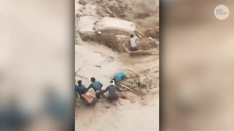 Good Samaritans rescue driver trapped in car during flood