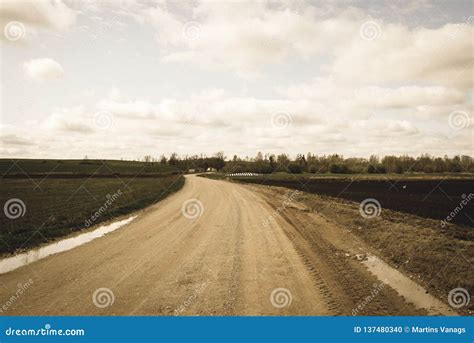 Country Gravel Road With Old And Broken Asphalt Vintage Retro Look