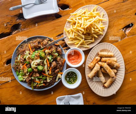 Filipino Meal Pancit Sotanghon Tuna Spring Rolls And French Fries