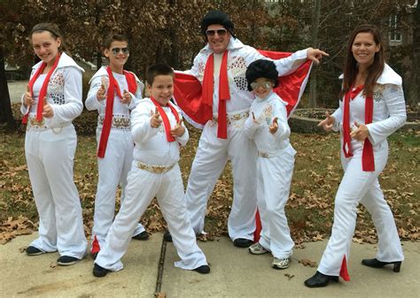 a group of people in white and red outfits posing for the camera with