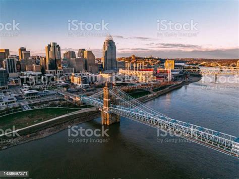 The John A Roebling Suspension Bridge Crossing The Ohio River Into