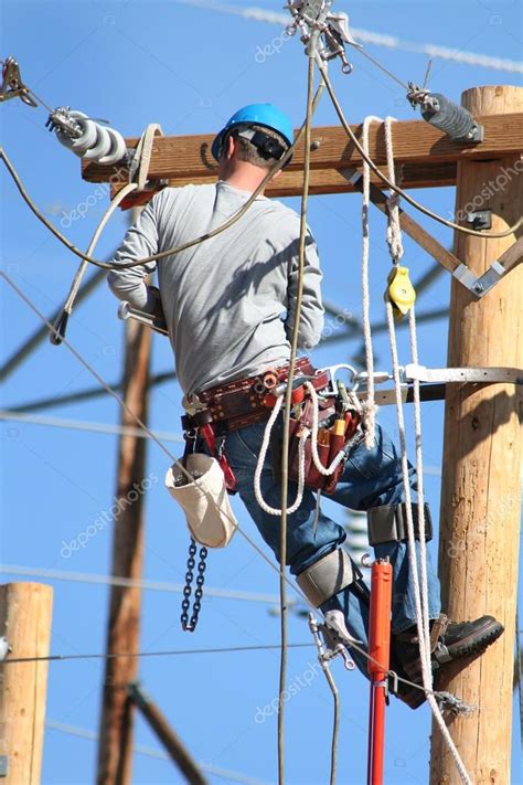 Electrical Lineman Working On Lines Stock Photo Graphicphoto