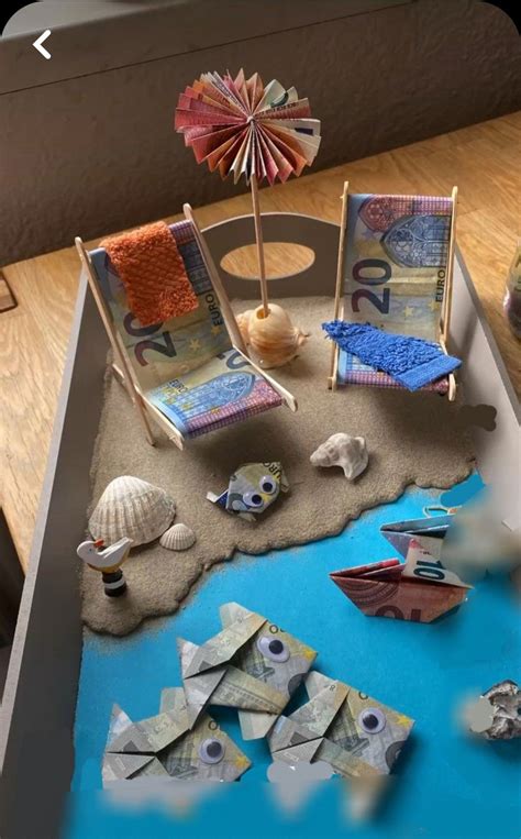 A Beach Scene Made Out Of Money And Seashells