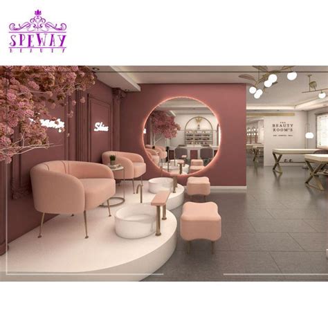 The Interior Of A Salon With Pink Chairs And Tables In Front Of A