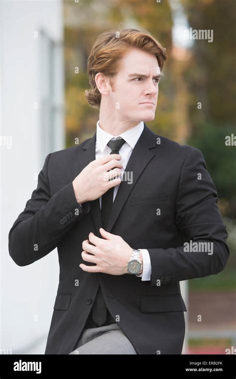 Business Man Adjusting Tie Outdoors Hi Res Stock Photography And Images