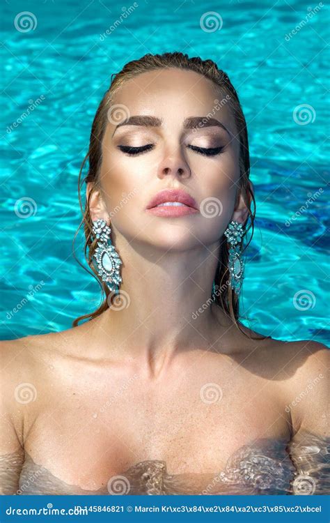 Elegant Woman In The Elegant Bikini On The Sun Tanned Slim And Shapely